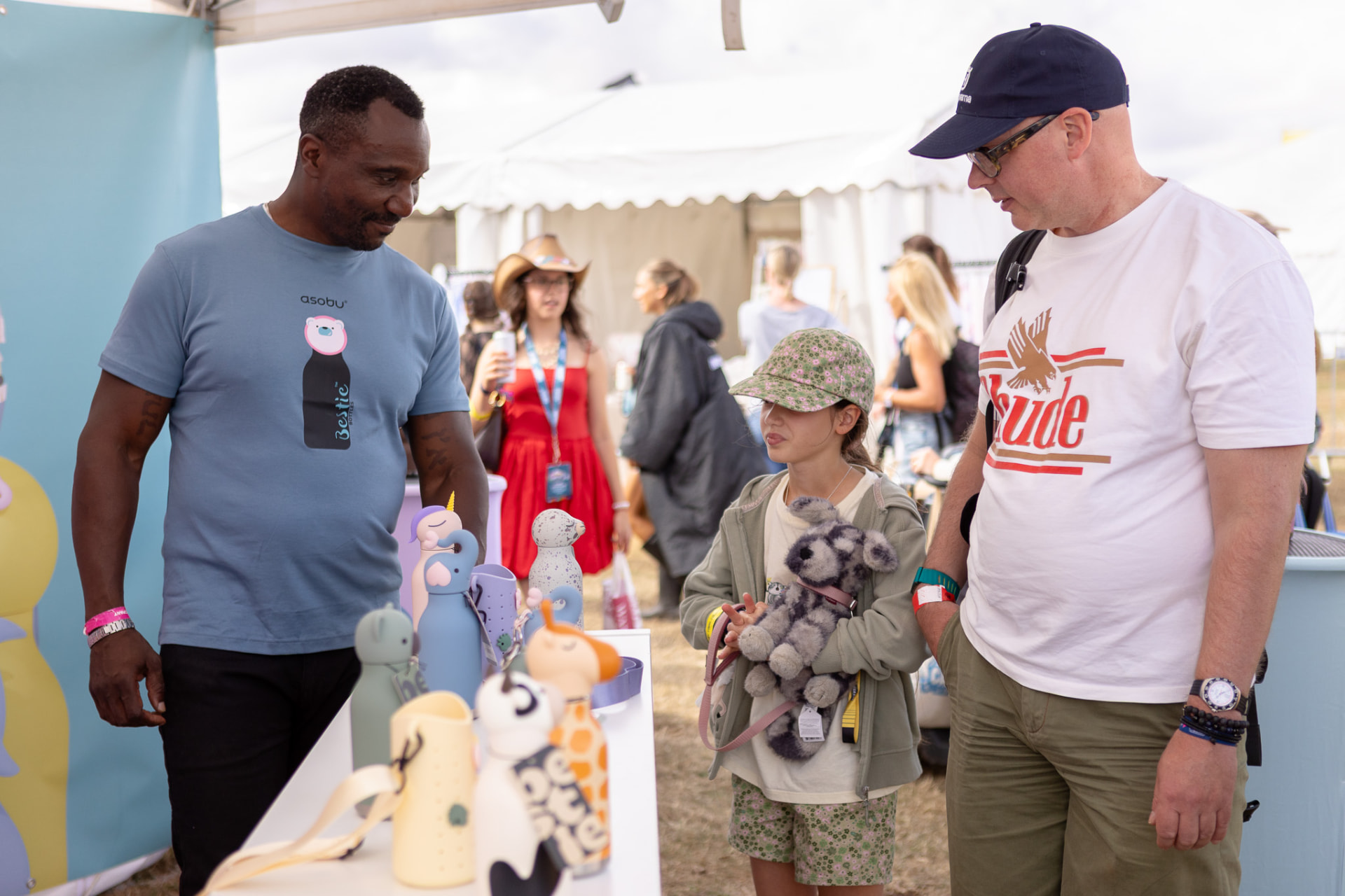 A Hello Consumer salesperson presenting a product bundle to a family at CarFest