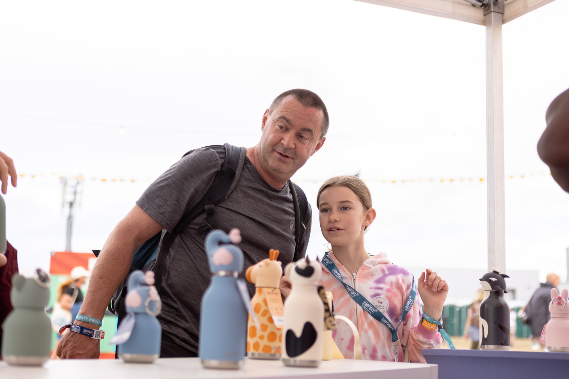 A Hello Consumer salesperson in conversation with a customer at a consumer event